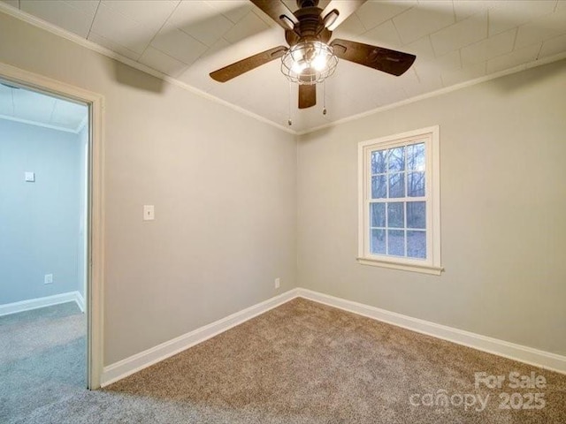 empty room with light carpet, ceiling fan, and ornamental molding