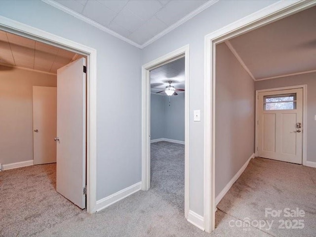 hall with light carpet and crown molding