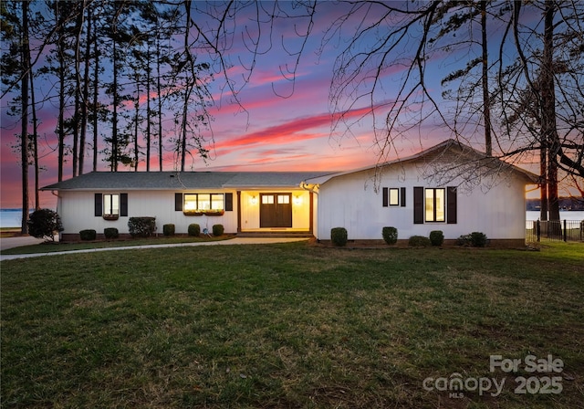 ranch-style house with a yard