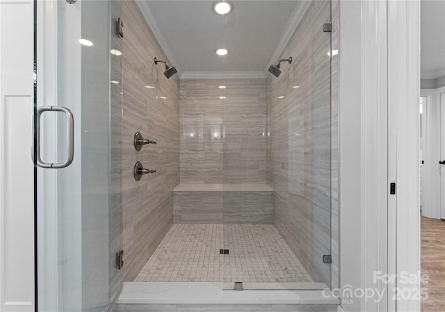 bathroom featuring an enclosed shower and crown molding