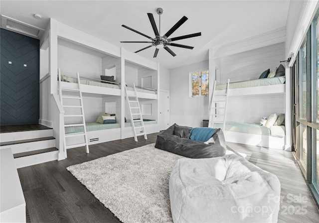 bedroom featuring ceiling fan and dark wood-type flooring