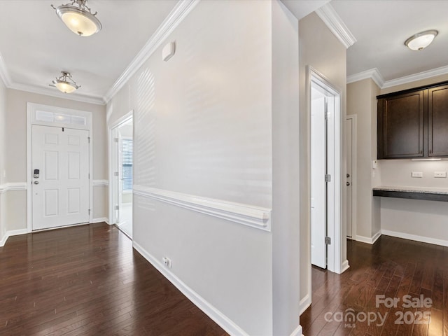 entrance foyer featuring dark hardwood / wood-style flooring and crown molding