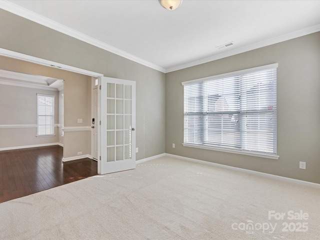 spare room with french doors, dark hardwood / wood-style flooring, and ornamental molding