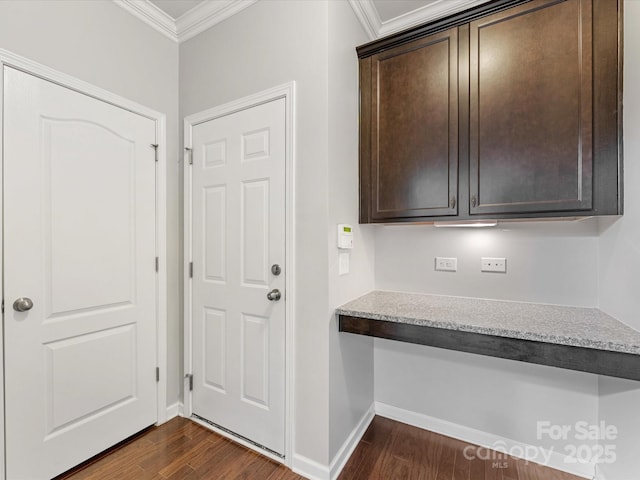 interior space with dark hardwood / wood-style flooring and ornamental molding