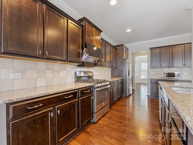 kitchen featuring light stone counters, dark brown cabinetry, crown molding, and appliances with stainless steel finishes