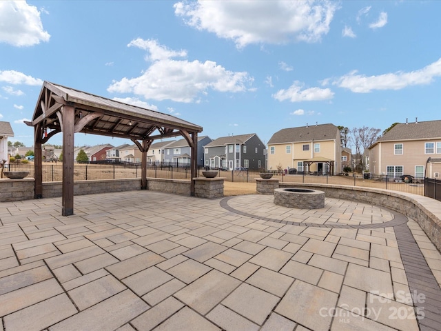 view of patio with a gazebo and an outdoor fire pit