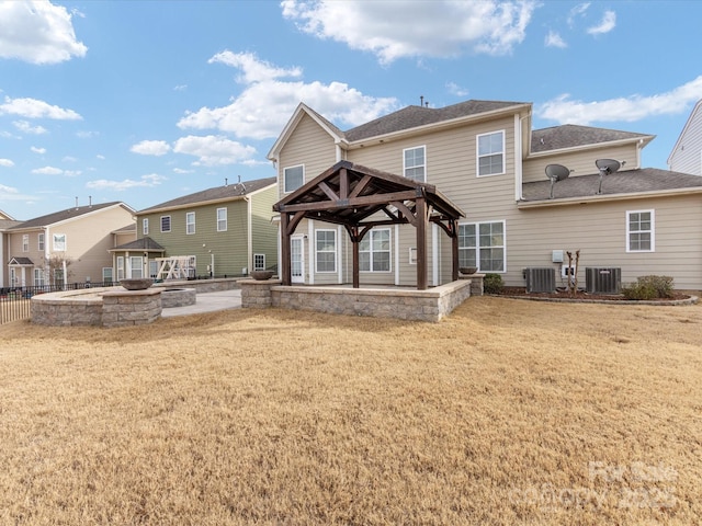 back of property with a gazebo, a yard, a patio, and cooling unit