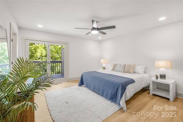 bedroom featuring ceiling fan, access to outside, and light hardwood / wood-style flooring