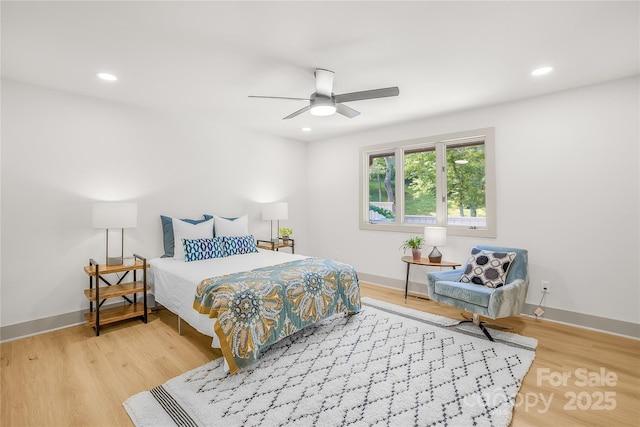 bedroom featuring hardwood / wood-style flooring and ceiling fan