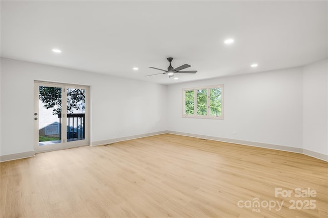 unfurnished room with ceiling fan and light hardwood / wood-style floors