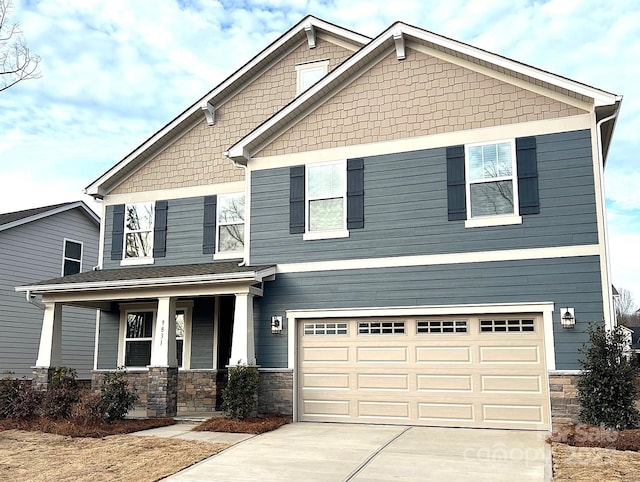 craftsman-style house with a garage and a porch