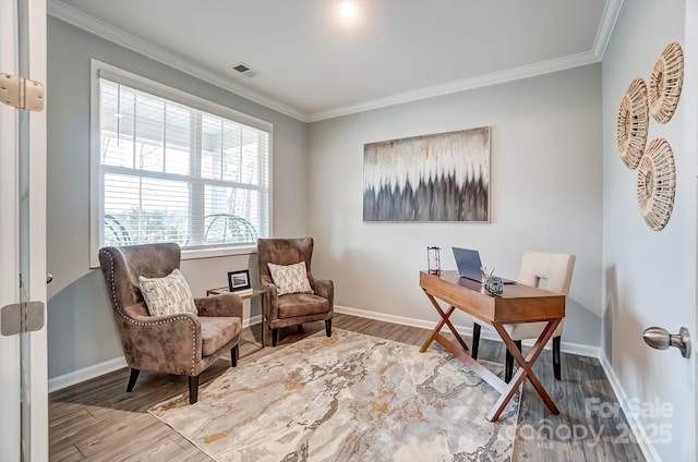 home office with ornamental molding, wood finished floors, visible vents, and baseboards