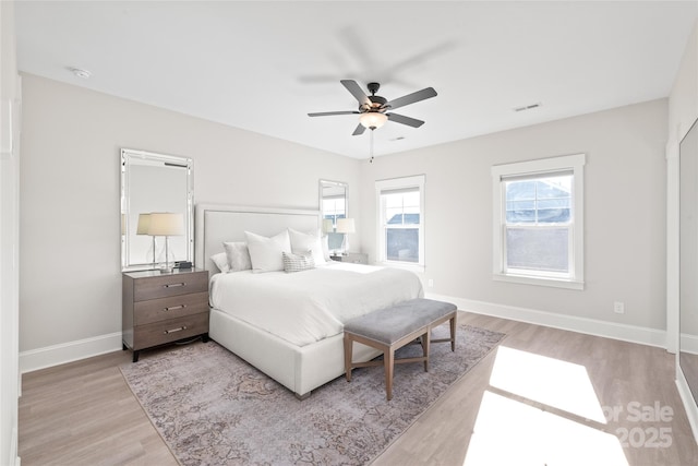 bedroom with light wood-type flooring and ceiling fan