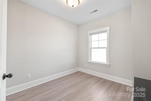 unfurnished room featuring light hardwood / wood-style floors