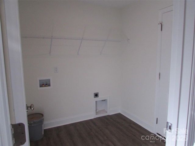 clothes washing area with hookup for an electric dryer, washer hookup, and dark hardwood / wood-style flooring