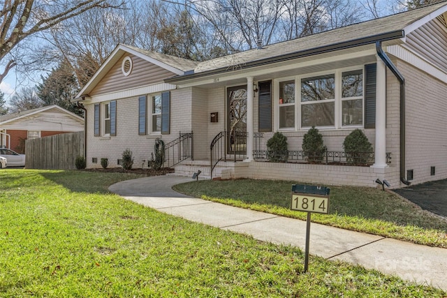 ranch-style home with a front lawn