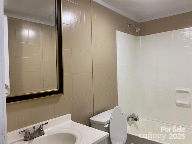 full bathroom featuring bathing tub / shower combination, vanity, tile walls, and toilet