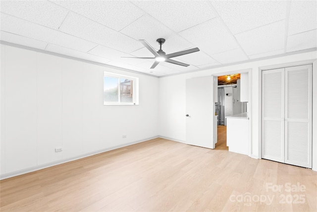 unfurnished bedroom featuring ceiling fan and light hardwood / wood-style floors