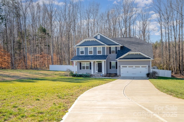 view of front of house featuring a garage and a front lawn