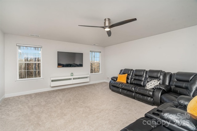 carpeted living room featuring ceiling fan