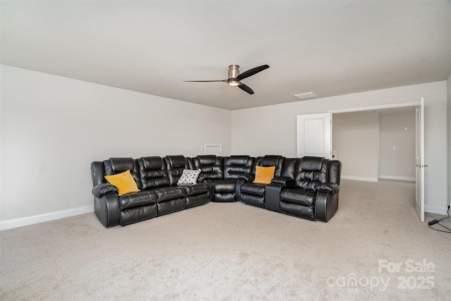 carpeted living room featuring ceiling fan