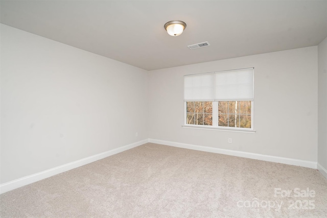 spare room featuring carpet flooring