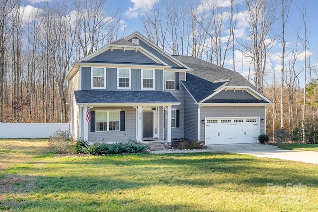 view of front of house featuring a front yard and a garage