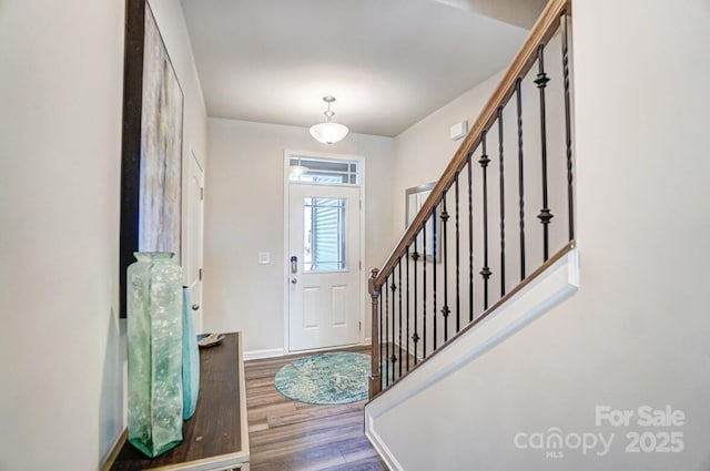 foyer entrance featuring hardwood / wood-style floors