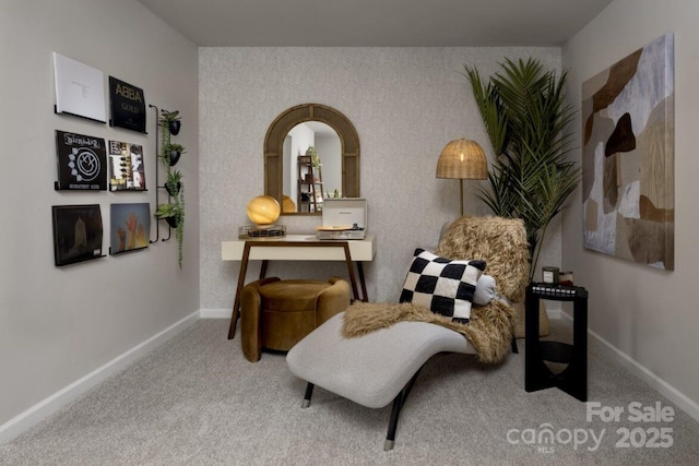 sitting room with carpet floors