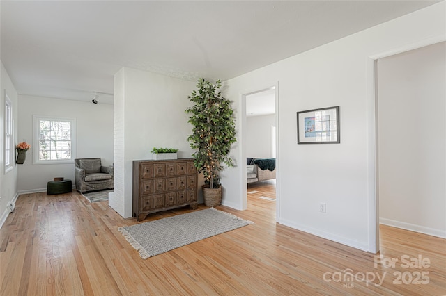 unfurnished room with light hardwood / wood-style flooring