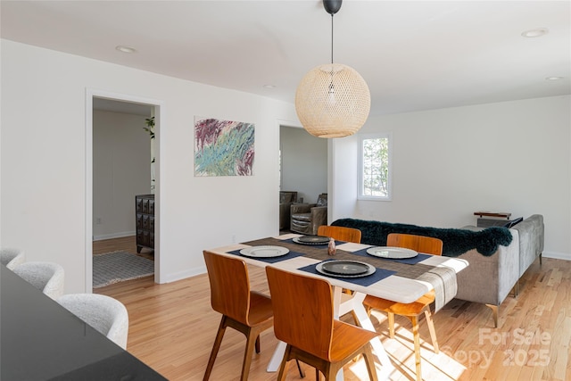 dining area featuring light wood-type flooring