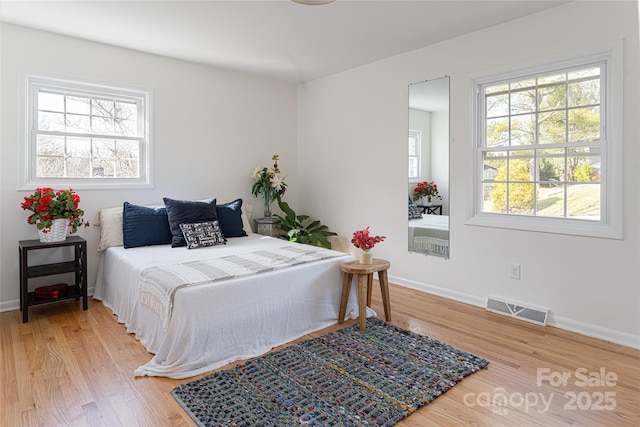 bedroom featuring wood-type flooring