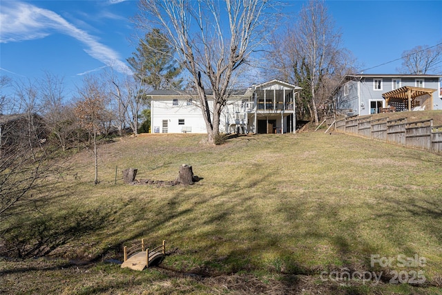 view of yard featuring a sunroom