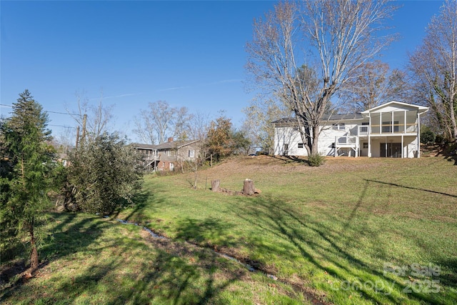 view of yard with a sunroom