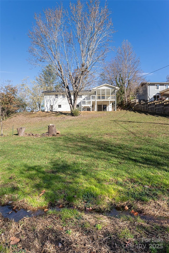 view of yard featuring a sunroom