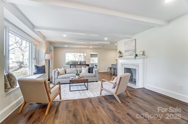 living room featuring beamed ceiling and dark wood-type flooring