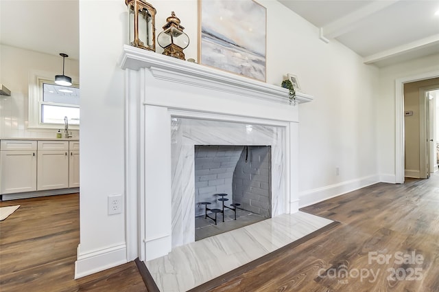 room details with hardwood / wood-style flooring and sink