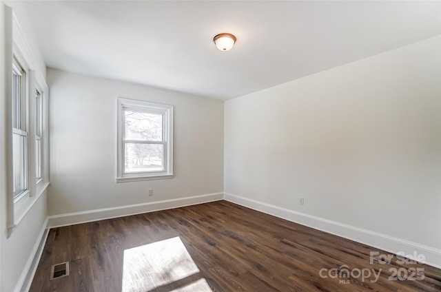 empty room with dark hardwood / wood-style floors