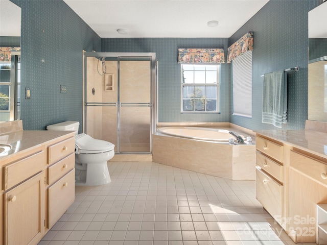 full bathroom featuring toilet, vanity, separate shower and tub, and tile patterned floors