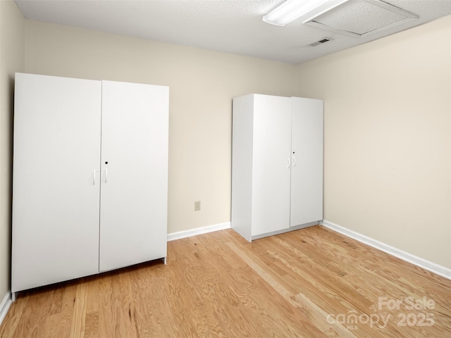 unfurnished bedroom with wood-type flooring