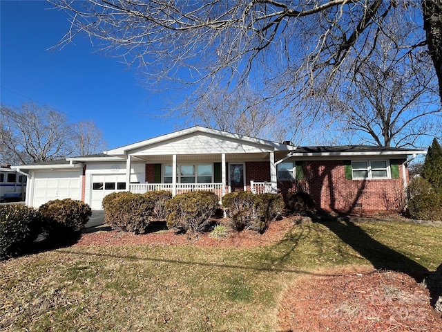 ranch-style house featuring a front lawn, covered porch, and a garage