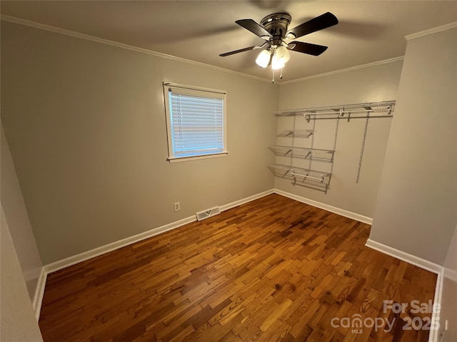 unfurnished room featuring hardwood / wood-style flooring, ceiling fan, and ornamental molding