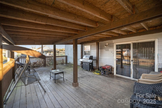 wooden terrace featuring grilling area