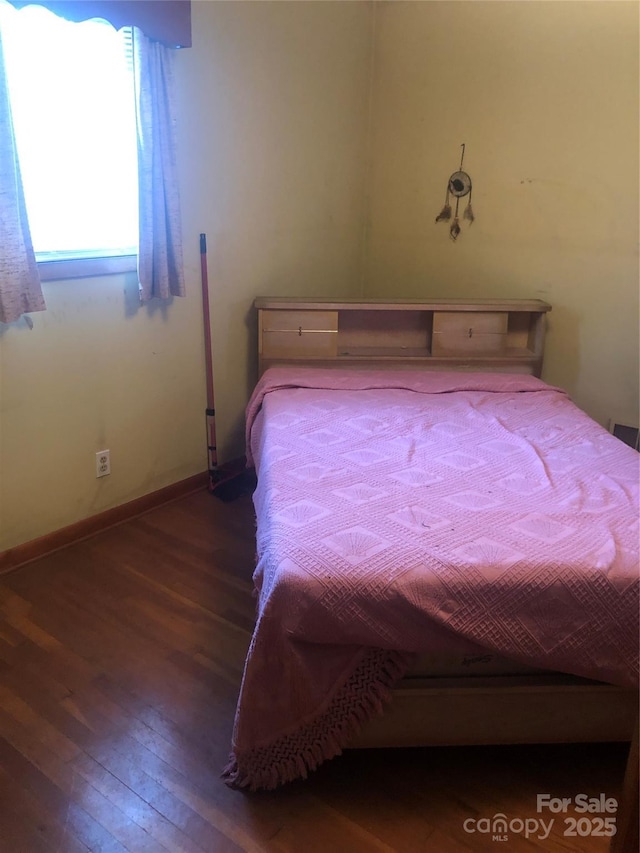 unfurnished bedroom featuring hardwood / wood-style floors