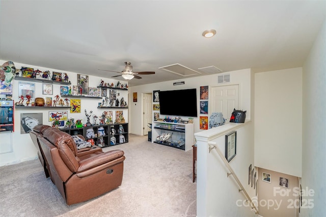 living room with ceiling fan and light carpet