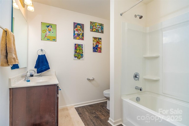 full bathroom with hardwood / wood-style flooring, vanity, shower / bathtub combination, and toilet