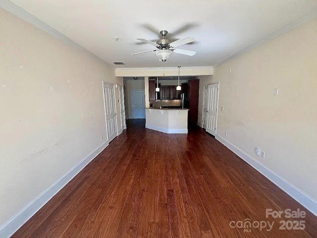 unfurnished living room featuring ceiling fan, dark hardwood / wood-style floors, and ornamental molding