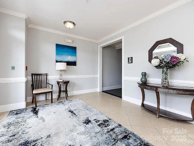 sitting room with crown molding and light tile patterned flooring