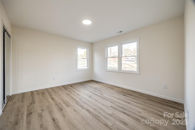 unfurnished bedroom featuring light wood-type flooring