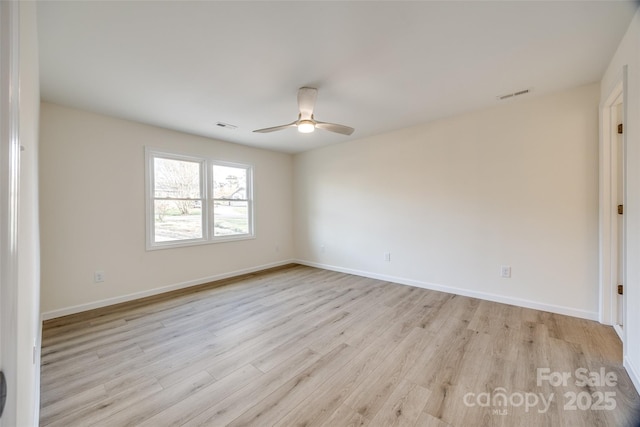 unfurnished room with ceiling fan and light hardwood / wood-style floors